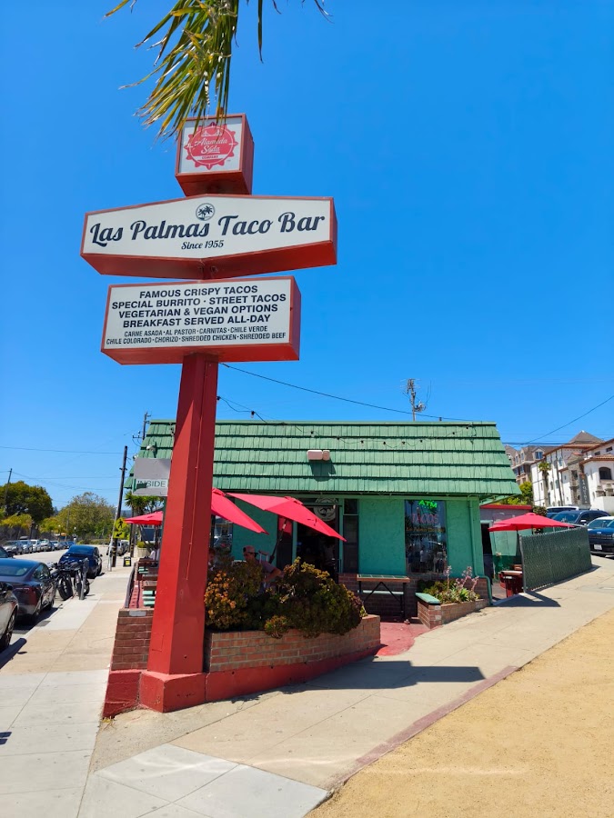 The Las Palmas Taco Bar sign: Famous crispy tacos, Special Burrito, street tacos, vegetarian and vegan options, breakfast served all day